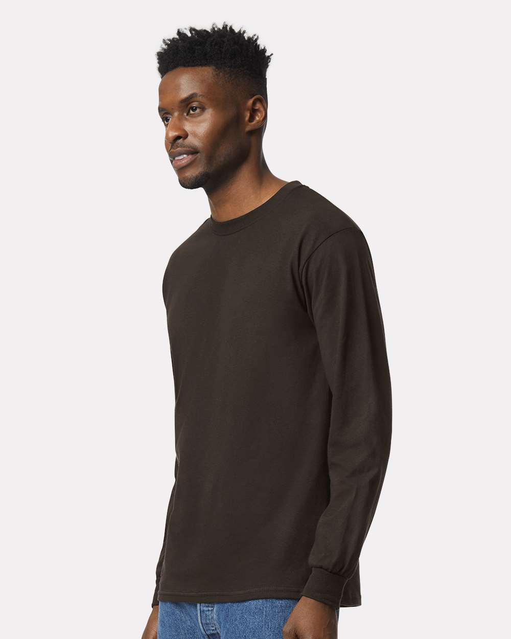 Man posing in a dark chocolate Gildan 2400 long sleeve tee.